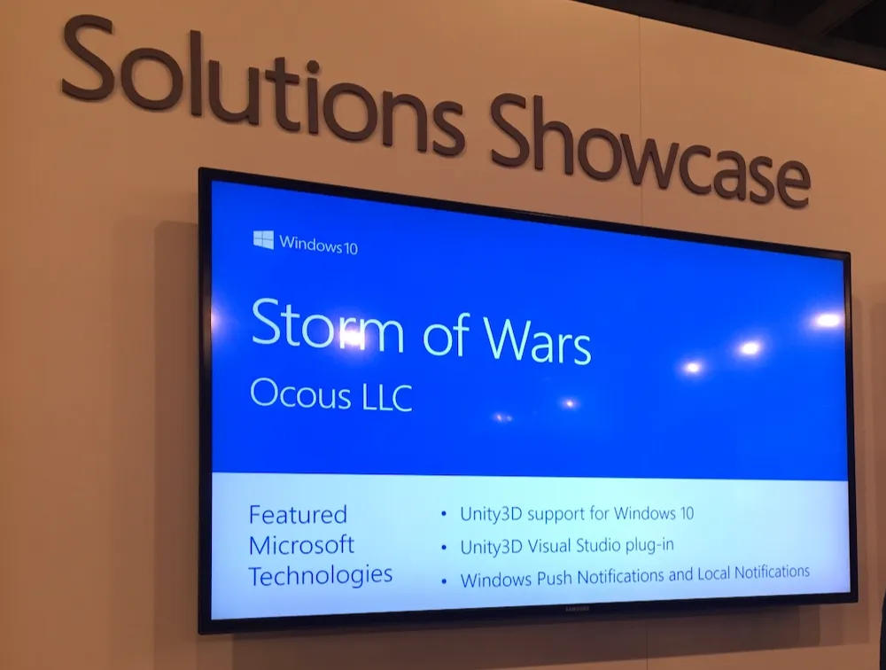 Storm of Wars featured on a screen at the Microsoft //build Solutions Showcase, listing its featured Windows 10 technologies